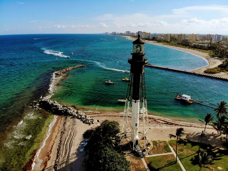 Aerial view of the Hillsboro Inlet Lighthouse above the inlet and beach